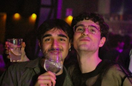 Two gay men enjoying drinks at Glamorize Roma, a gay party in Rome, Italy. Nightlife scene with drinks and friends. Gay travel advice.