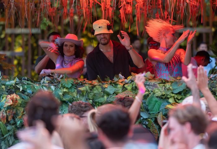 Glitterbox at Hï Ibiza gay club: DJs perform for a crowd. Party scene with dancing, music, and vibrant energy. Ibiza nightlife for gay men.