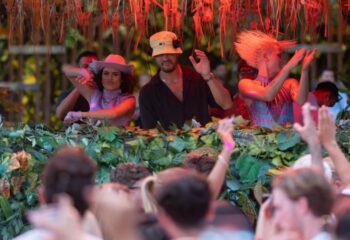 Glitterbox at Hï Ibiza gay club: DJs perform for a crowd. Party scene with dancing, music, and vibrant energy. Ibiza nightlife for gay men.