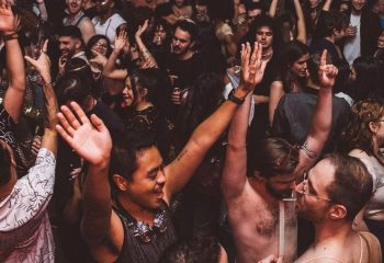 Crowd at Glitterbox @ Hi Ibiza gay club. People dancing with hands up. Ibiza nightlife. Gay travel destination.