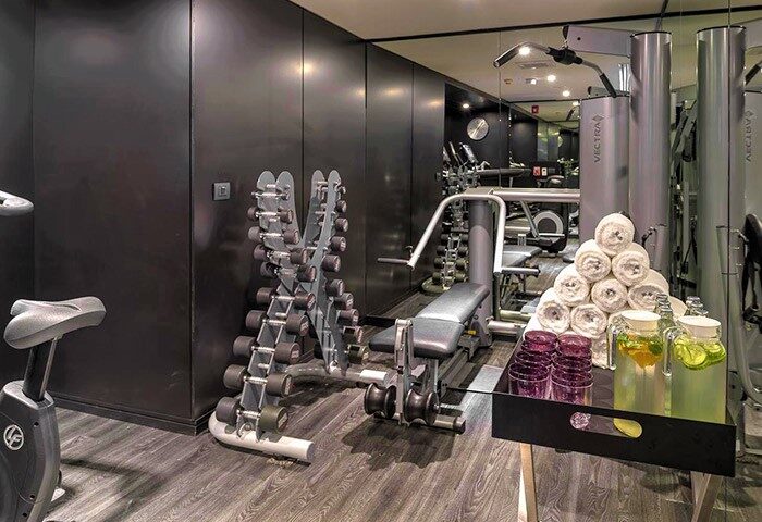 Akyra Manor Chiang Mai's gym. This luxury hotel in Nimman offers a great location for gay travelers. Fitness equipment, weights.