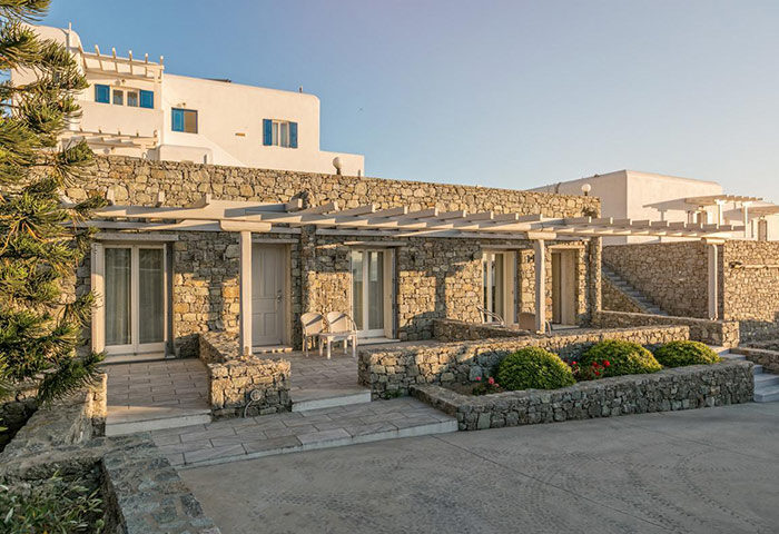 Hotel Alkyon, Mykonos. Stone building with terrace. Design hotel near gay bars and cruise club. Greece travel for gay men.