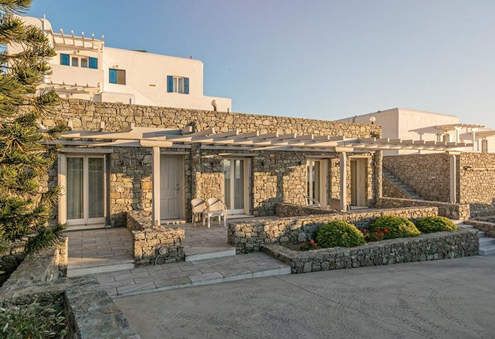 Hotel Alkyon, Mykonos. Stone building with terrace. Design hotel near gay bars and cruise club. Greece travel for gay men.