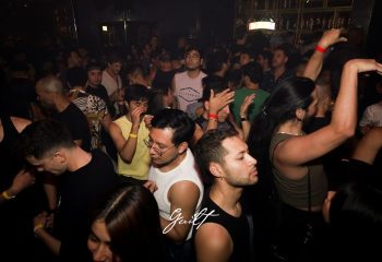Crowd at Guilt Night Club, a gay bar in Mexico. People are dancing, enjoying the nightlife. Gay travel advice.