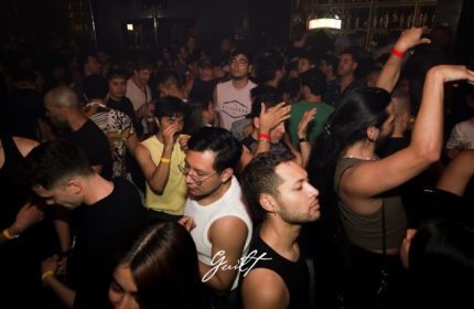 Crowd at Guilt Night Club, a gay bar in Mexico. People are dancing, enjoying the nightlife. Gay travel advice.