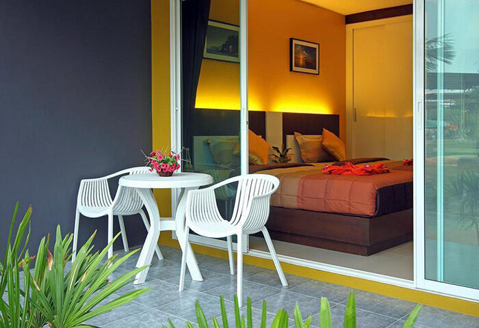 Gypsy Sea View Resort room with balcony. Gay hotel in Phi Phi. Cheap hotel with swimming pool. Table and chairs on the balcony.