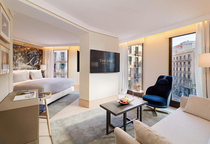H10 The One Barcelona hotel room. Best gay honeymoon hotel. Luxury suite interior with city views. Modern design, perfect for gay travel.