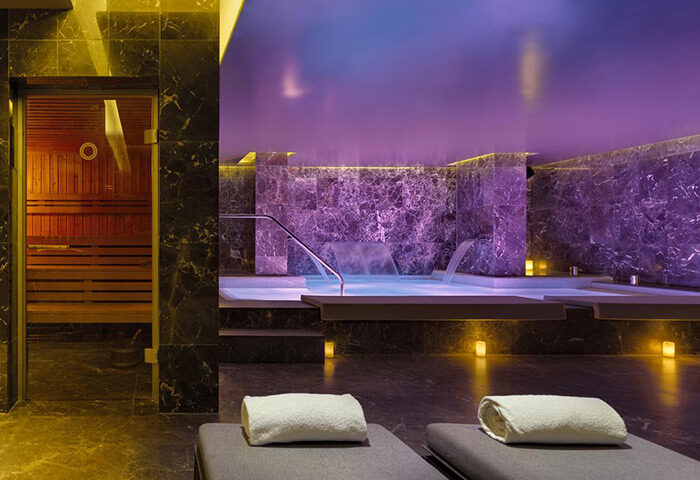 H10 The One Barcelona: Luxury gay hotel near gay bars & saunas. Spa with sauna, pool, lounge chairs. Relaxing gay travel in Barcelona.