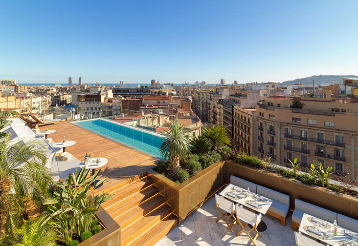 H10 The One Barcelona: Rooftop pool at luxury gay hotel in Eixample city center. Enjoy dining with a view in Barcelona's vibrant gay scene.