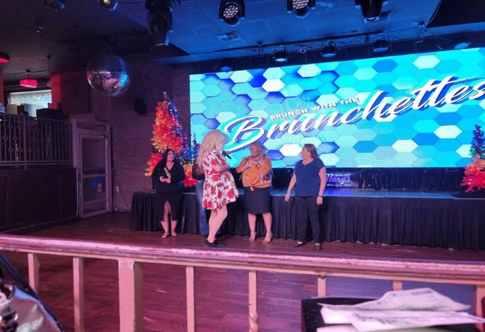 Hamburger Mary's Long Beach drag show. Drag queen performing Brunch with the Brunchettes on stage. Gay travel destination.