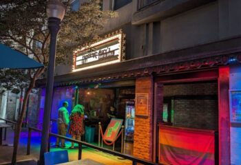 Hamburger Mary's in Long Beach. Gay bar and grill at night with rainbow lights. Popular gay travel destination.