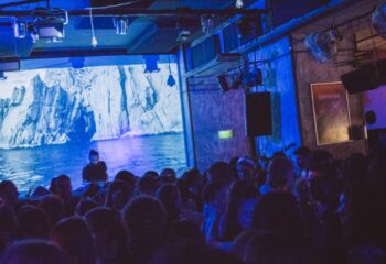 Hello Party at Toldi Club, Budapest. DJ performing for a crowd at a gay-friendly party. Nightlife, travel advice.
