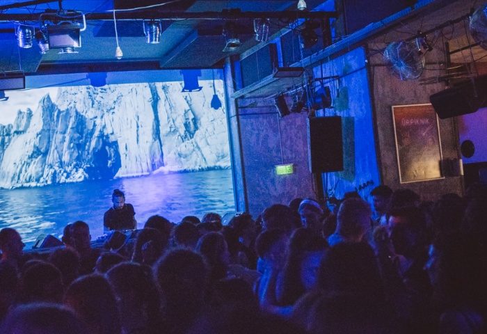 Hello Party at Toldi Club, Budapest. DJ performing for a crowd at a gay-friendly party. Nightlife, travel advice.
