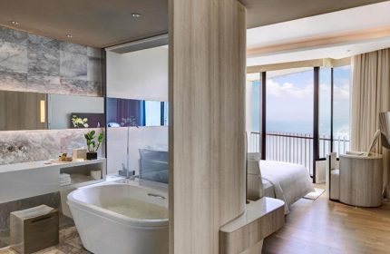 Hilton Pattaya honeymoon suite. Luxury gay hotel near Pattaya Beach, Thailand. Modern bathroom and bedroom with ocean view.