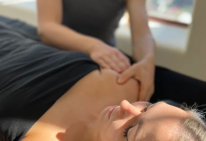 Relaxing Hollywood massage experience. A person receiving a shoulder massage. Gay travel advice for finding the best spa treatments.