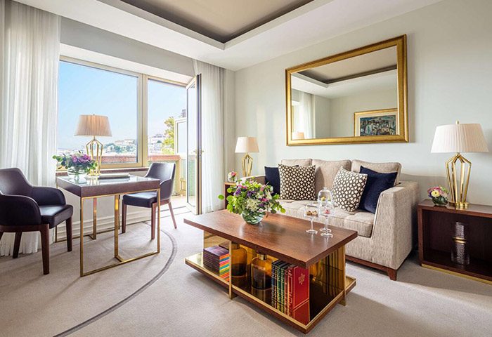 Tivoli Avenida Liberdade luxury hotel suite in Lisbon. Honeymoon hotel idea for gay travelers. City center view from balcony.