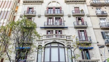 Hotel Victoria Palace, best gay hotel in Barcelona city center near Gaixample. Building facade with balconies and shutters.