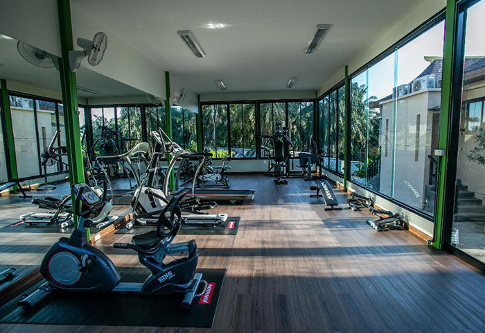 Gym at Hula Hula Resort Ao Nang, Krabi. Fitness equipment for gay travelers. Cheap pool villas with gym. Hotel with treadmills and weights.
