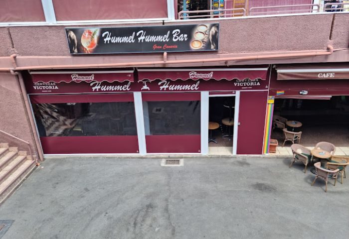 Hummel Hummel Bar in Gran Canaria. Exterior view of the gay bar with its name on the awning. Gay travel destination in Spain.