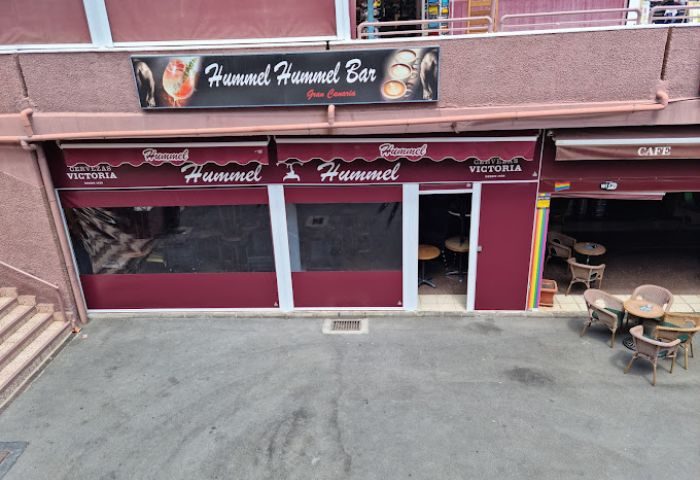 Hummel Hummel Bar in Gran Canaria. Exterior view of the gay bar with its name on the awning. Gay travel destination in Spain.