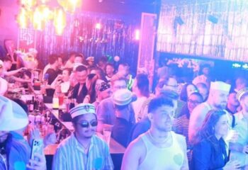 Crowded gay bar in Shanghai. People socializing, drinking, and enjoying the nightlife. Gay travel advice, Hunt Shanghai.