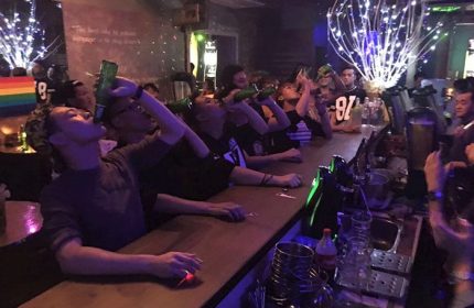 Iblue Bar & Cafe Kuala Lumpur gay night life. Men & women drinking beer at the bar. Popular gay nightlife in Kuala Lumpur, Malaysia.