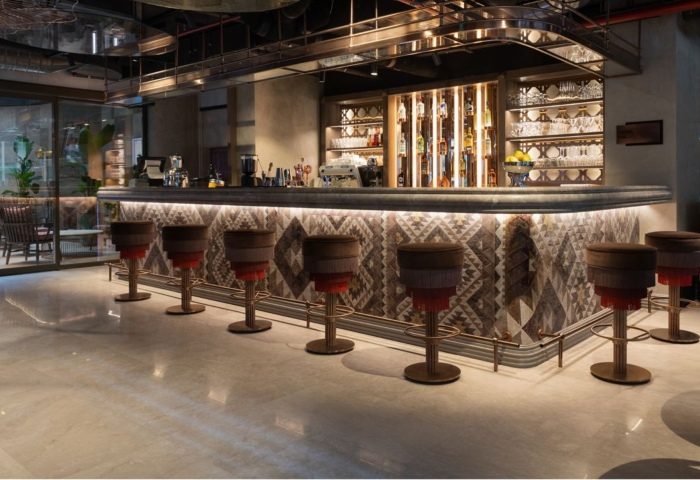 Burdock Hotel Istanbul bar. Chic interior, perfect for Instagram. Stylish stools line the bar. Gay travel. Autograph Collection hotel.