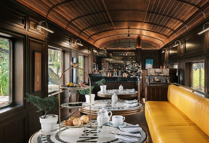 InterContinental Khao Yai Resort train carriage cafe. Top gay honeymoon hotels near Bangkok, Thailand. Luxury travel, stylish interior.