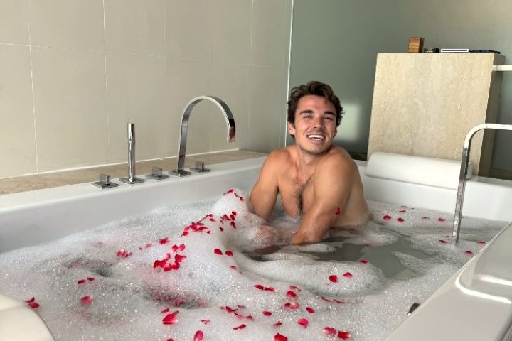 Gay travel: Jared Reinfeldt enjoys a bubble bath with rose petals at Vana Belle, a Luxury Collection Resort in Koh Samui, Thailand.