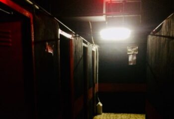 Dark corridor at K-Men Club, Rome. Lockers and private cabins. Gay travel advice for men. Nightlife spot. Interior view.