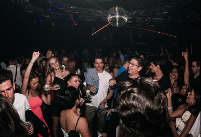 Kinselas Bar Sydney: A diverse crowd of gay men and women dancing under a disco ball. Nightlife and travel advice in Australia.