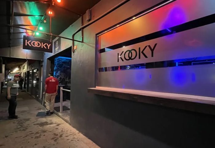 Kooky Karaoke entrance in Puerto Vallarta. Gay nightlife spot with colorful lights and a modern facade. Popular gay bar in Mexico.