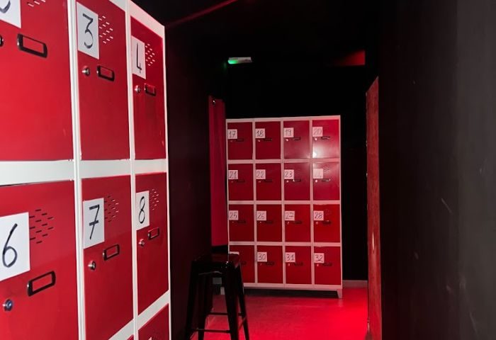 Lockers at Kuma Bar, Benidorm. Red lockers with numbers for storing personal items during a gay party in Benidorm. Gay travel advice.