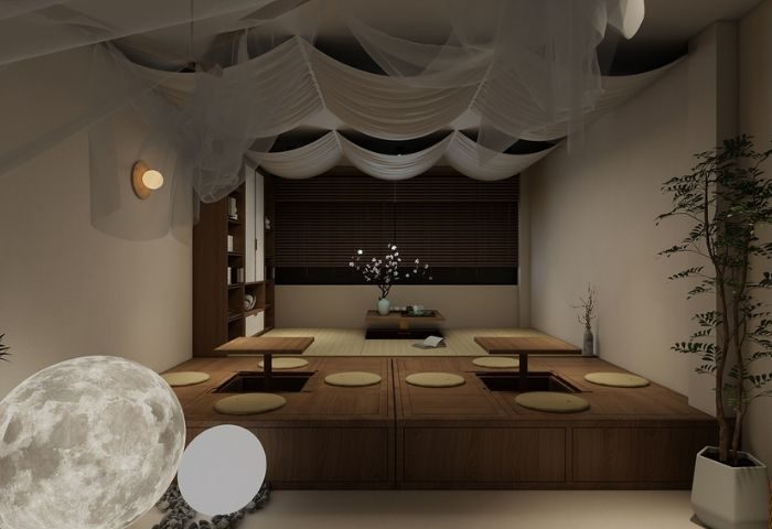 Kuma Club Las Vegas: Interior view of the gay bathhouse with a Japanese-style lounge area, low tables, and soft lighting.