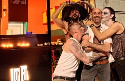LOLA Milan bar: Group of gay men in costume, celebrating Halloween in Milan's gay district. Nightlife for gay travelers in Italy.