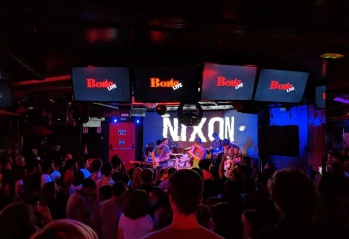 La Boite Gay Club, Madrid: Live band Nixon performing on stage to a crowded audience. Nightlife at this gay club in Spain.