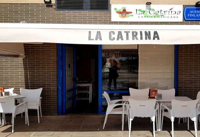 La Catrina Cantina, a gay bar in Puerto Vallarta. Exterior view of the Mexican restaurant with tables and chairs outside. Gay travel destination.