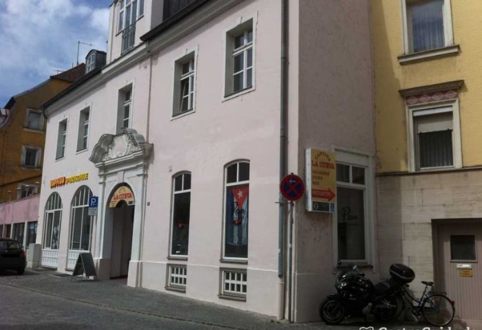 La Cueva Cantina gay bar in Puerto Vallarta: Building exterior with sign. A gay travel destination for gay men in Puerto Vallarta, Mexico.