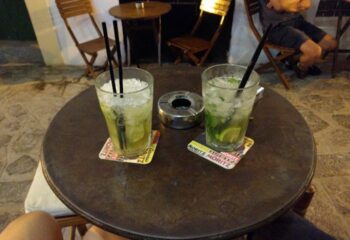 Two Mojitos at Lady D. gay bar in Ibiza. Refreshing cocktails on a table, perfect for gay travel and nightlife in Ibiza.