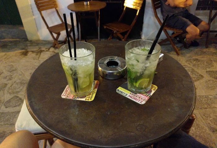 Two Mojitos at Lady D. gay bar in Ibiza. Refreshing cocktails on a table, perfect for gay travel and nightlife in Ibiza.