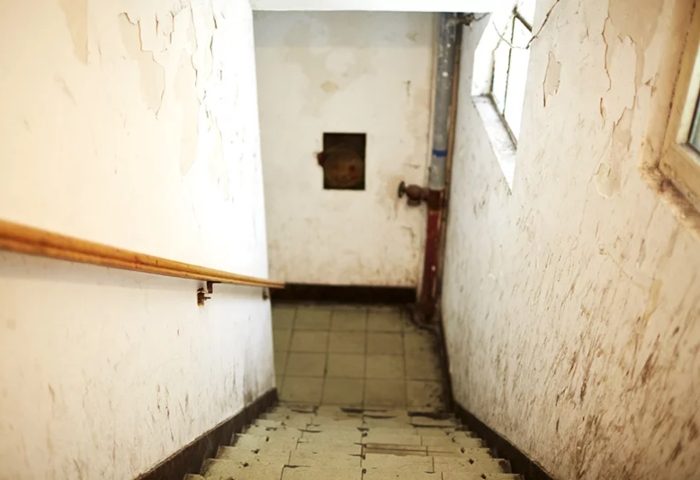 Stairway to Lai Lai Dance Hall, a gay travel destination. Decaying walls, window, and handrail. Come 来 来 dance at this unique spot.
