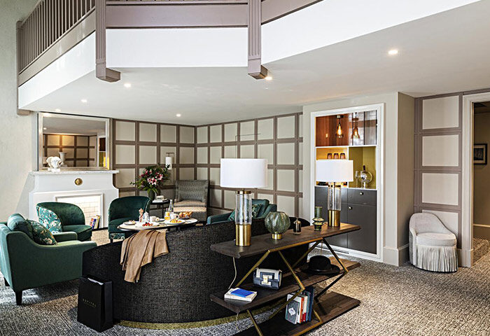 Sofitel Le Scribe Paris Opéra hotel suite. Gay-friendly hotel for gay honeymoon in Paris. Luxurious interior with stylish furniture.