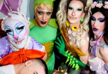 Gay Rome travel: Latte Fresco drag queens. Performers in colorful costumes and makeup pose together. Nightlife and queer culture in Italy.