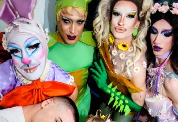 Gay Rome travel: Latte Fresco drag queens. Performers in colorful costumes and makeup pose together. Nightlife and queer culture in Italy.