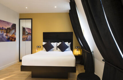 Le Relais du Marais Hotel room, Paris. Close to gay nightlife. Modern design, black & white decor, double bed, stylish curtains. Great location.