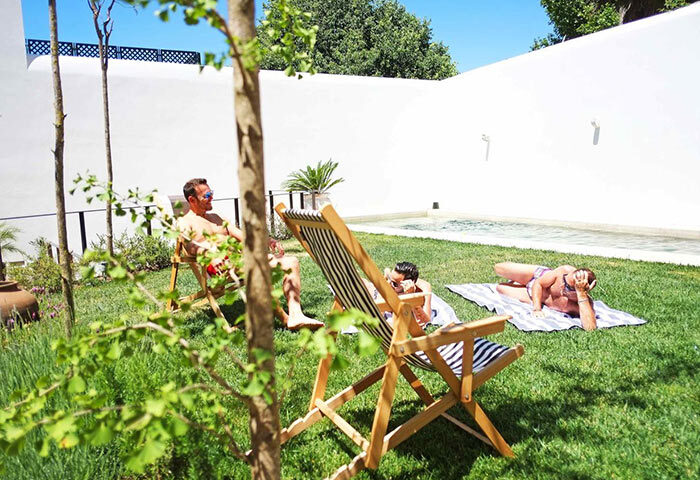 The Late Birds Lisbon Gay Urban Resort: Gay men relax by the pool in this popular men-only hotel. Best gay hotel in Lisbon.