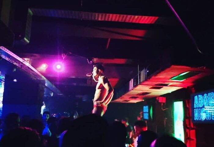 Istanbul gay nightlife: A dancer performs at a gay club. The crowd enjoys the show at Point, a popular gay dance spot in Istanbul, Turkey.
