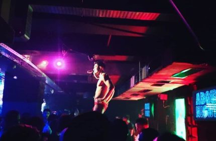 Istanbul gay nightlife: A dancer performs at a gay club. The crowd enjoys the show at Point, a popular gay dance spot in Istanbul, Turkey.