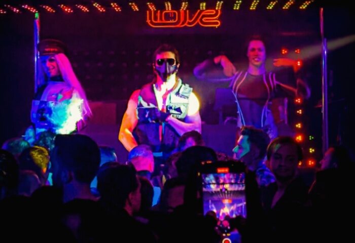 Istanbul gay nightlife: Dancers perform at Love Dance Point, a gay club. Crowd watches the show, some filming with their phones.