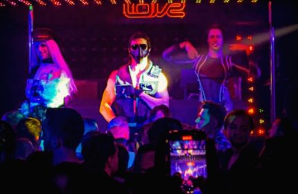 Istanbul gay nightlife: Dancers perform at Love Dance Point, a gay club. Crowd watches the show, some filming with their phones.